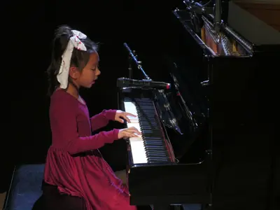 Girl plays piano at 2025 Cerritos Talent Showcase
